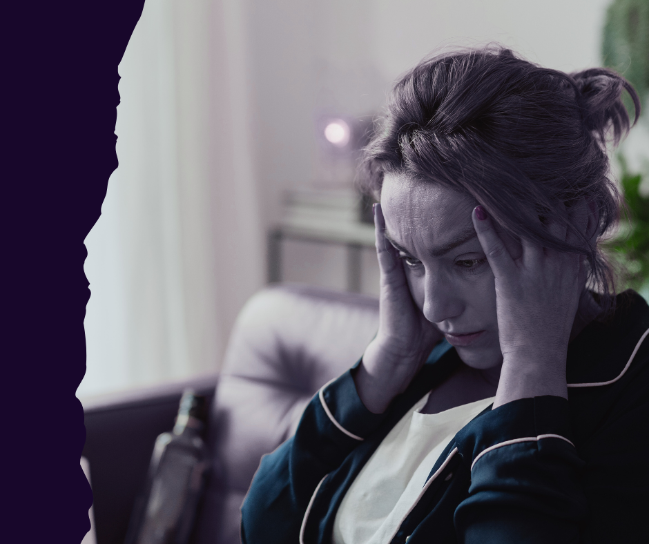 Woman holding head in stress, highlighting chronic stress impact on women's health.