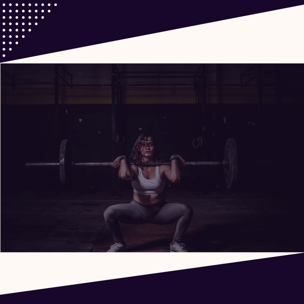 Woman lifting weights to build muscle for longevity and metabolic health.