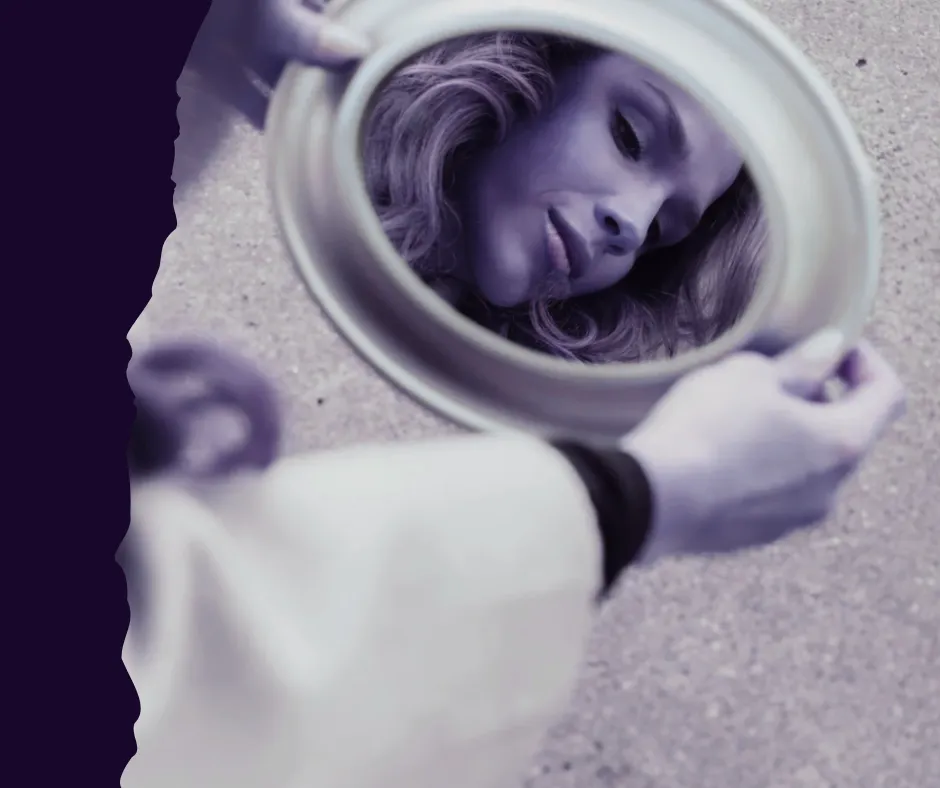 Midlife woman reflecting in natural light symbolizing nervous system healing during perimenopause